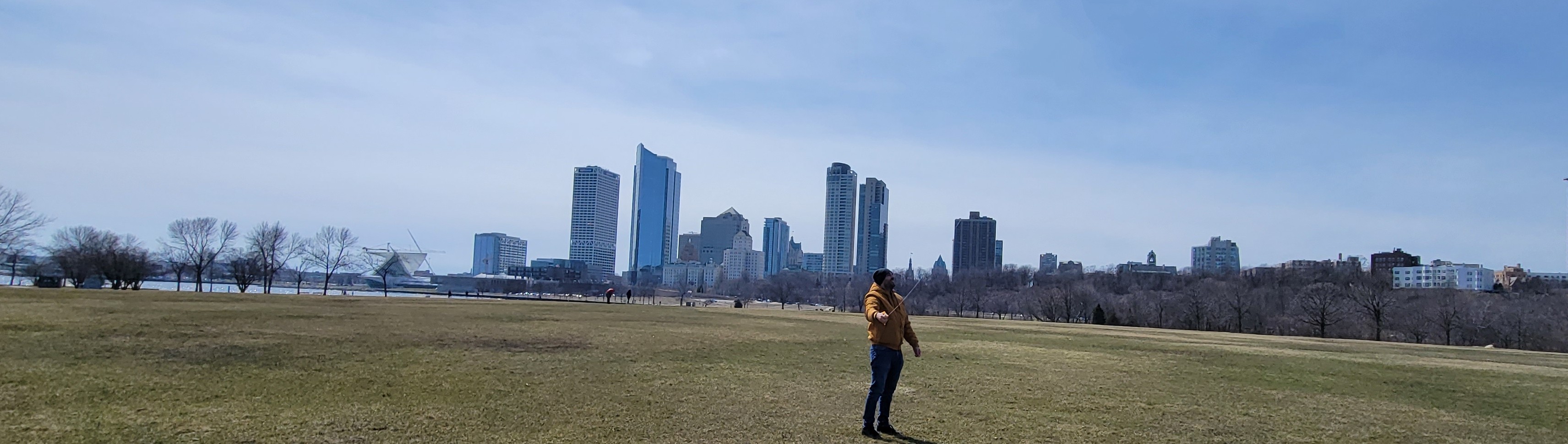 Daniel Alarcon standing in front of a skyscraper